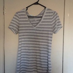 A gray striped T-shirt with a V-neck on it